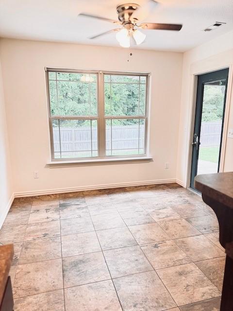 1117 Nemett Dr, Pea Ridge, AR 72751 - spare room featuring ceiling fan and baseboards