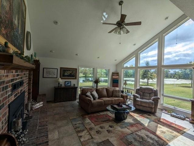 11328 Jolly Mill Ln, Pierce City, MO 65723 - living room with high vaulted ceiling, a fireplace, and ceiling fan