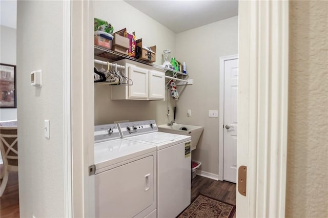 2 Moniave Ln, Bella Vista, AR 72715 - laundry area featuring cabinet space, washer and dryer, and dark wood-style floors