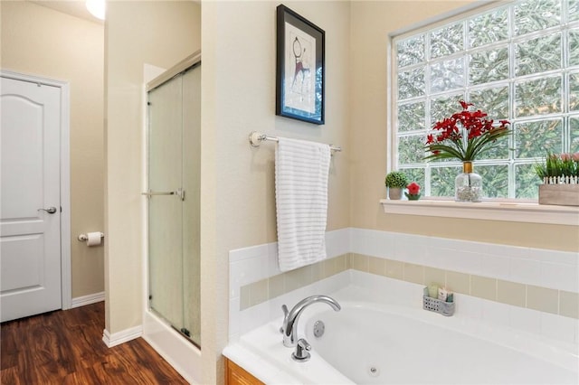 2 Moniave Ln, Bella Vista, AR 72715 - bathroom with a stall shower, plenty of natural light, a whirlpool tub, and wood finished floors
