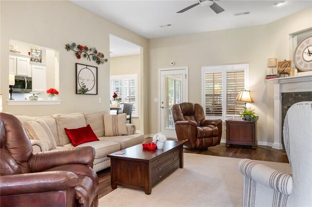 2 Moniave Ln, Bella Vista, AR 72715 - living room featuring ceiling fan, wood finished floors, and a premium fireplace