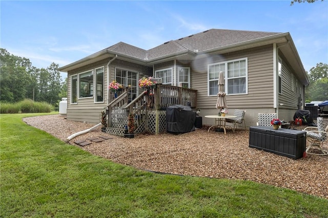 2 Moniave Ln, Bella Vista, AR 72715 - back of house featuring a yard, a wooden deck, and roof with shingles