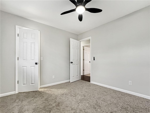 405 14th Pl, Rogers, AR 72756 - unfurnished bedroom featuring carpet flooring, baseboards, and ceiling fan