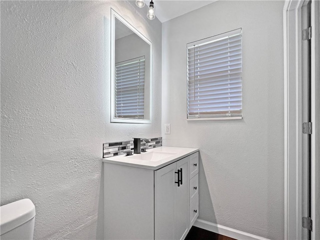 405 14th Pl, Rogers, AR 72756 - bathroom featuring vanity, toilet, and a textured wall
