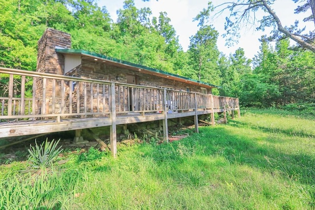 1732 Madison Unit 4316, Elkins, AR 72727 - rear view of property with a deck and a chimney