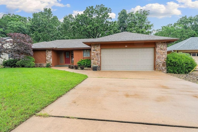 11 Yarmouth Dr, Bella Vista, AR 72715 - view of front facade featuring stone siding, an attached garage, a front lawn, concrete driveway, and roof with shingles
