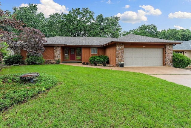 11 Yarmouth Dr, Bella Vista, AR 72715 - view of front of property featuring stone siding, an attached garage, a front lawn, and driveway