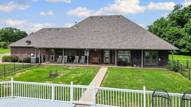 12976 Hummingbird Rd, Elkins, AR 72727 - rear view of house featuring brick siding, a shingled roof, central air condition unit, and a patio area