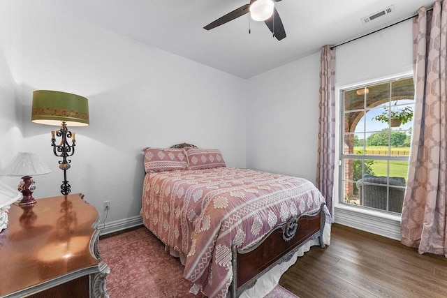 12976 Hummingbird Rd, Elkins, AR 72727 - bedroom featuring wood finished floors, baseboards, and ceiling fan