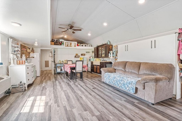 12976 Hummingbird Rd, Elkins, AR 72727 - living area featuring wood finished floors, ceiling fan, and lofted ceiling