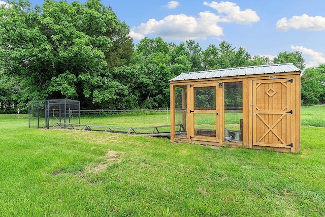 12976 Hummingbird Rd, Elkins, AR 72727 - view of yard featuring an outbuilding and exterior structure
