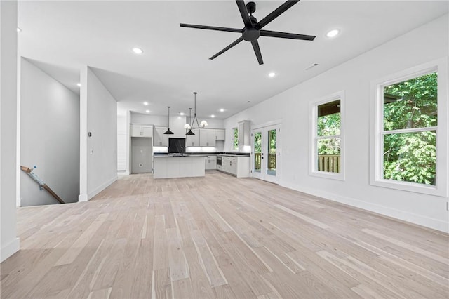 1421 Lee St, Pea Ridge, AR 72751 - unfurnished living room with light wood finished floors, recessed lighting, and a ceiling fan