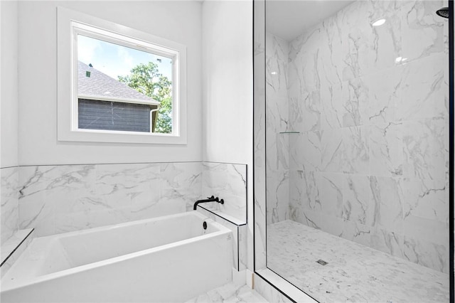 1421 Lee St, Pea Ridge, AR 72751 - bathroom featuring a garden tub, marble look tiles, and a marble finish shower