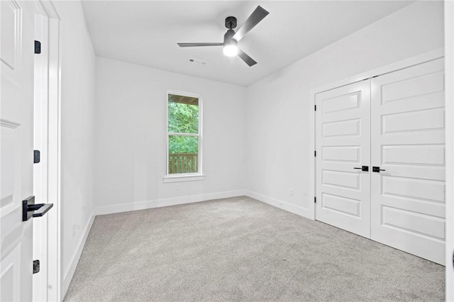 1421 Lee St, Pea Ridge, AR 72751 - unfurnished bedroom featuring carpet, a closet, and a ceiling fan