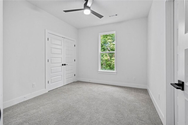 1421 Lee St, Pea Ridge, AR 72751 - unfurnished bedroom with carpet flooring, a ceiling fan, and a closet