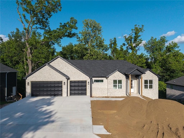 1421 Lee St, Pea Ridge, AR 72751 - view of front of home featuring concrete driveway and a garage
