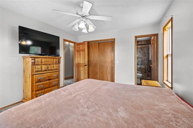 51 NW Ridge Rd, Eureka Springs, AR 72631 - bedroom with a closet, a ceiling fan, ensuite bathroom, and baseboards