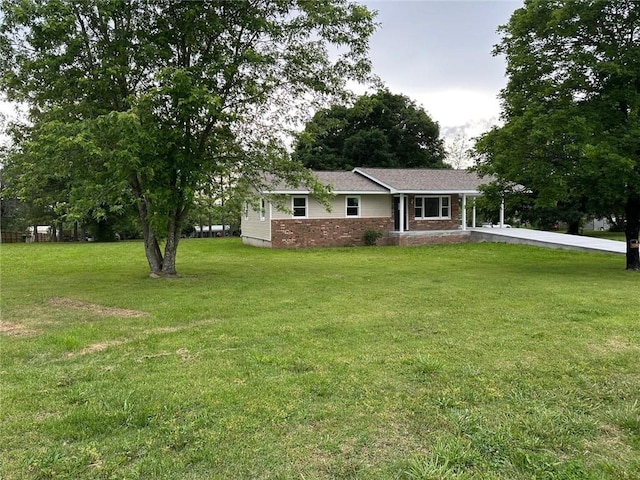 154 Mc 7059, Flippin, AR 72634 - view of front of property with a front yard and brick siding