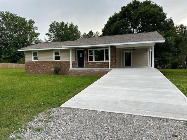 154 Mc 7059, Flippin, AR 72634 - ranch-style home featuring concrete driveway, brick siding, an attached carport, and a front yard