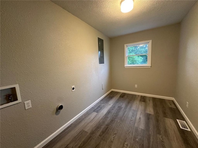 154 Mc 7059, Flippin, AR 72634 - laundry area with dark wood-style floors, hookup for an electric dryer, hookup for a washing machine, a textured ceiling, and electric panel