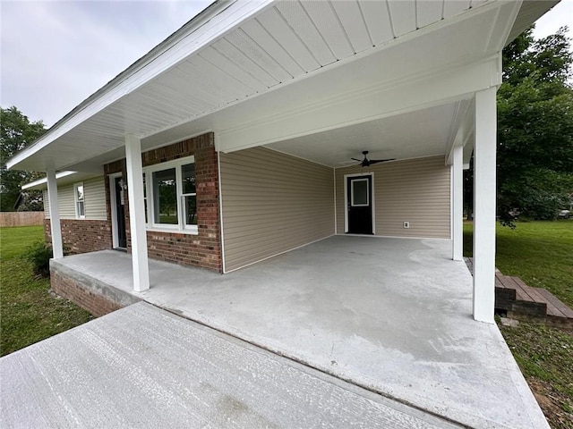 154 Mc 7059, Flippin, AR 72634 - covered porch featuring a carport, a yard, and a ceiling fan