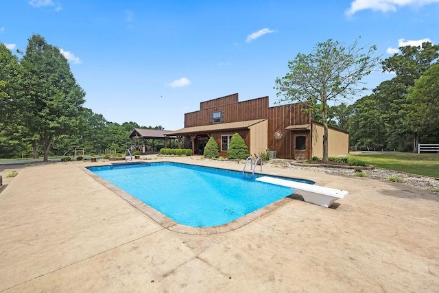 19537 Eastfork Ln, Gravette, AR 72736 - outdoor pool with a patio and a diving board