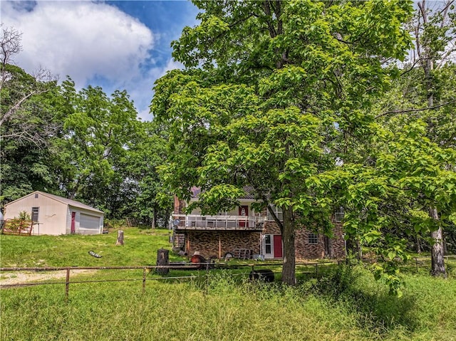 585 County Road 217, Berryville, AR 72616 - view of yard with a detached garage, an outbuilding, and a wooden deck