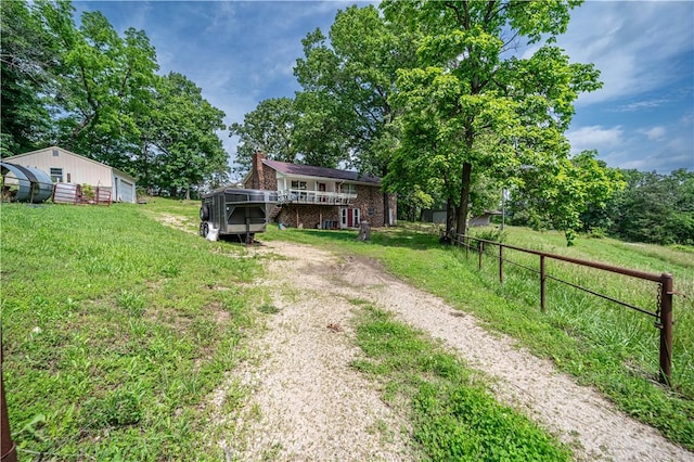 585 County Road 217, Berryville, AR 72616 - view of yard with a wooden deck, driveway, and an outdoor structure