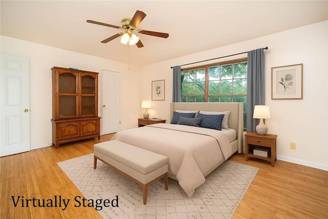 585 County Road 217, Berryville, AR 72616 - bedroom featuring light wood-style floors, baseboards, and ceiling fan