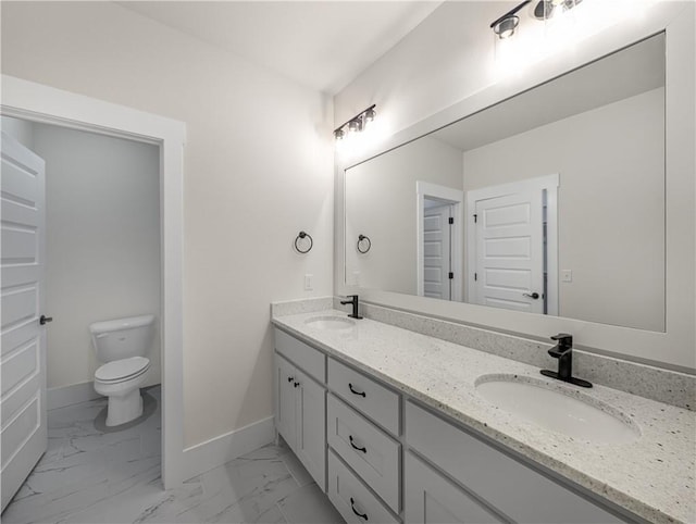 1821 Bluestem Dr, Centerton, AR 72719 - bathroom with double vanity, toilet, marble look tile flooring, and baseboards