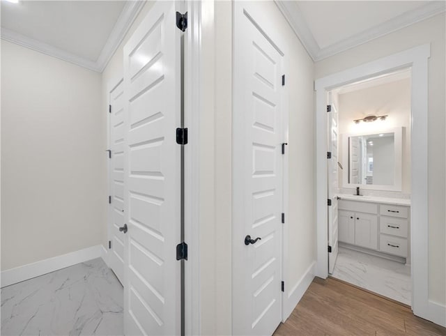 1821 Bluestem Dr, Centerton, AR 72719 - hall with crown molding, light marble finish floors, baseboards, and a sink