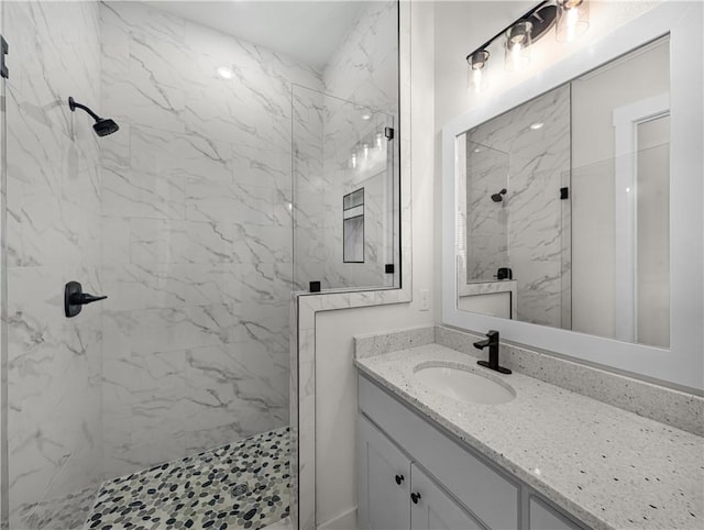 1821 Bluestem Dr, Centerton, AR 72719 - bathroom featuring vanity and a marble finish shower