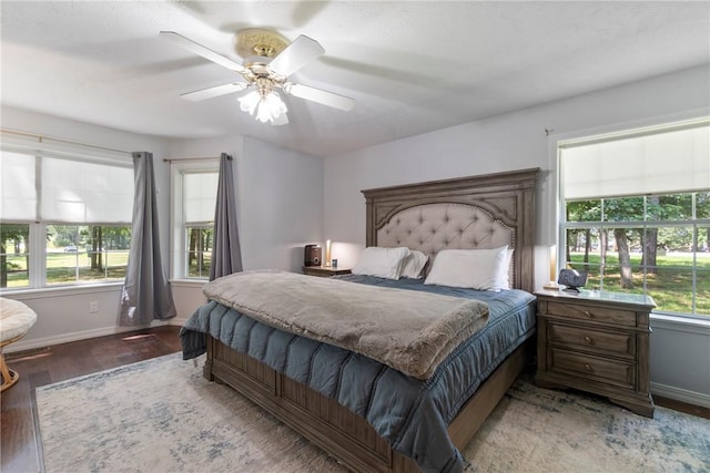 4 Hillcrest Dr, Holiday Island, AR 72631 - bedroom featuring baseboards, wood finished floors, and ceiling fan