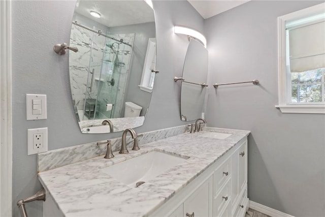 4 Hillcrest Dr, Holiday Island, AR 72631 - bathroom with a marble finish shower, double vanity, toilet, and baseboards