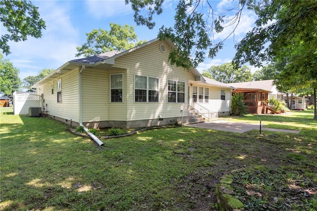 4 Hillcrest Dr, Holiday Island, AR 72631 - view of property exterior with crawl space, a patio area, central AC unit, and a yard