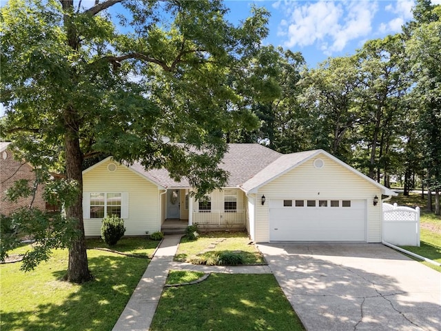 4 Hillcrest Dr, Holiday Island, AR 72631 - ranch-style house with driveway, an attached garage, a front lawn, a porch, and roof with shingles