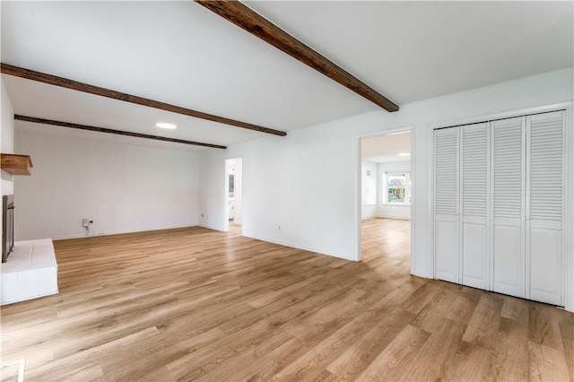 800 Summit Dr, Rogers, AR 72756 - unfurnished living room with beam ceiling, light wood-type flooring, recessed lighting, and baseboards