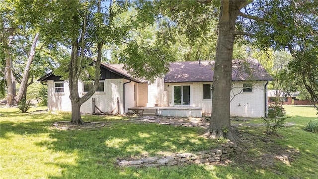 800 Summit Dr, Rogers, AR 72756 - view of front of property featuring brick siding, a front lawn, and board and batten siding