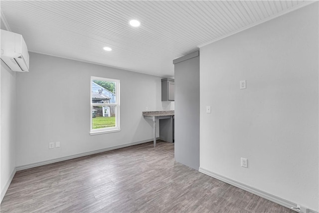404 Hargis St, Huntsville, AR 72740 - unfurnished living room with recessed lighting, wood finished floors, and a wall unit AC