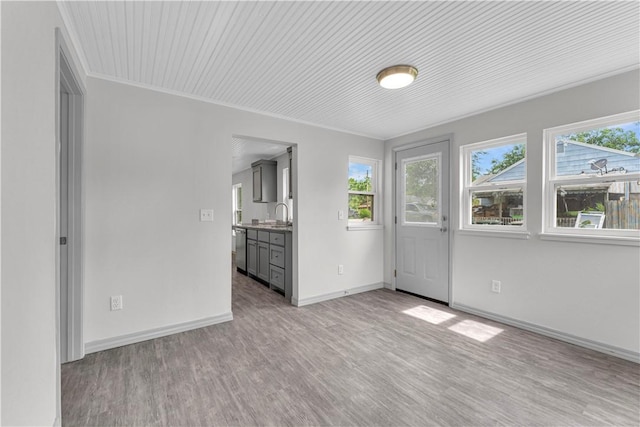 404 Hargis St, Huntsville, AR 72740 - unfurnished room with plenty of natural light, light wood finished floors, and crown molding