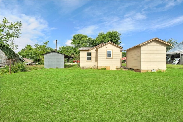 404 Hargis St, Huntsville, AR 72740 - back of property with a shed, a lawn, and crawl space