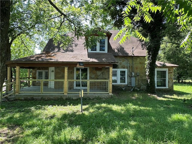 301 W Bean St, Lincoln, AR 72744 - rear view of property featuring stone siding and a yard