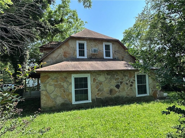 301 W Bean St, Lincoln, AR 72744 - rear view of house with stone siding, a lawn, and roof with shingles