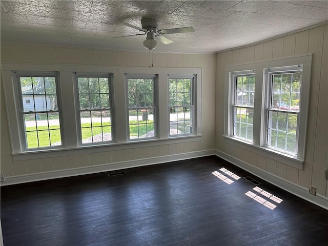 301 W Bean St, Lincoln, AR 72744 - unfurnished room with dark wood-style flooring, ceiling fan, and baseboards