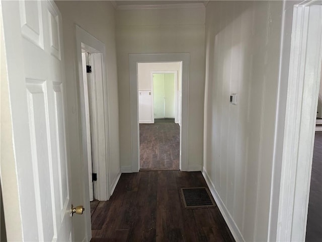 301 W Bean St, Lincoln, AR 72744 - hall featuring dark wood finished floors, ornamental molding, and baseboards
