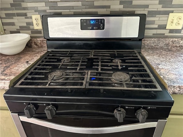 301 W Bean St, Lincoln, AR 72744 - kitchen view of stainless steel range with gas cooktop and decorative backsplash