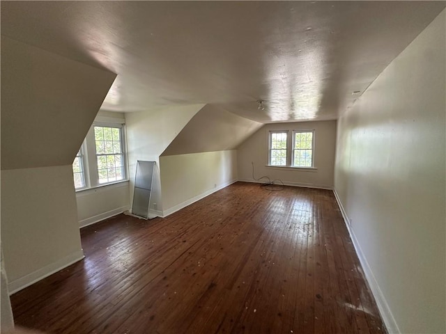 301 W Bean St, Lincoln, AR 72744 - additional living space with hardwood / wood-style floors, lofted ceiling, and baseboards
