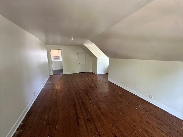 301 W Bean St, Lincoln, AR 72744 - additional living space featuring dark wood-style flooring, lofted ceiling, and baseboards
