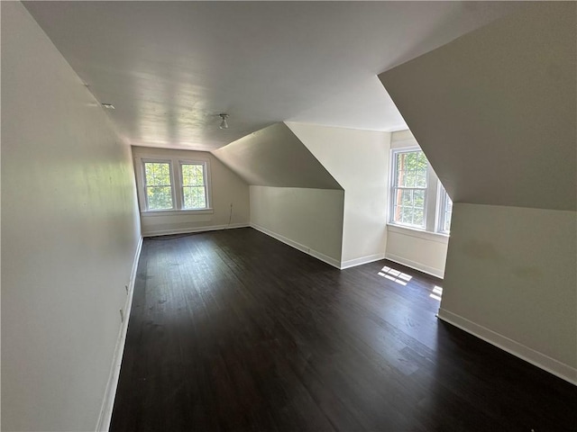 301 W Bean St, Lincoln, AR 72744 - bonus room featuring baseboards, dark wood-style floors, and vaulted ceiling