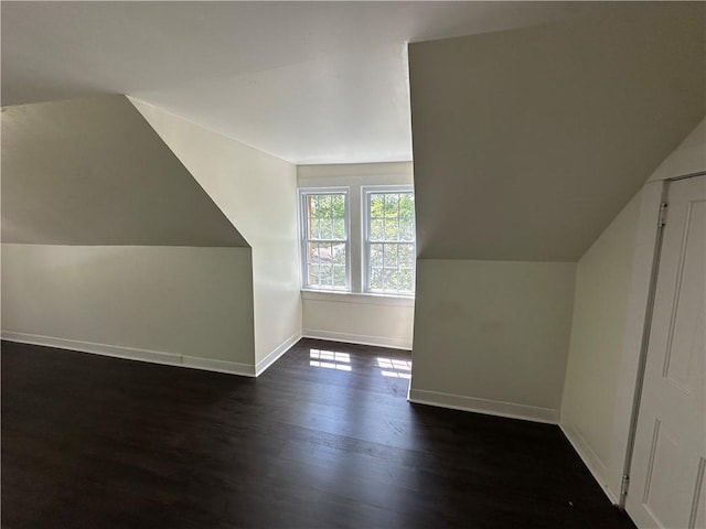 301 W Bean St, Lincoln, AR 72744 - additional living space with baseboards, dark wood-style floors, and lofted ceiling